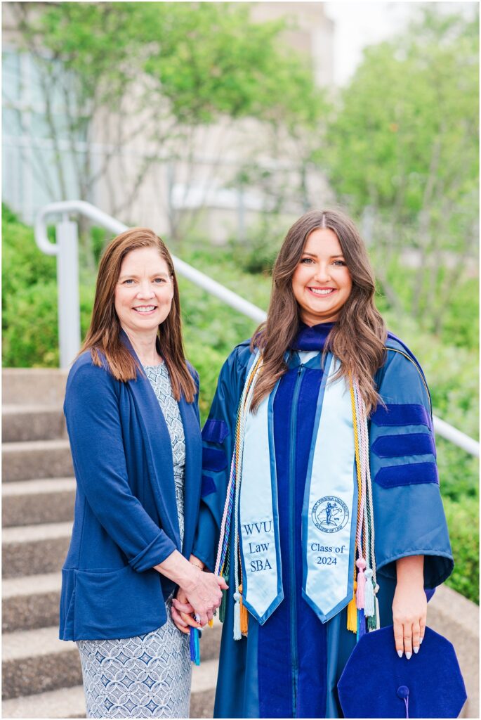 law school graduate posing with her mom at West Virginia University near Morgantown