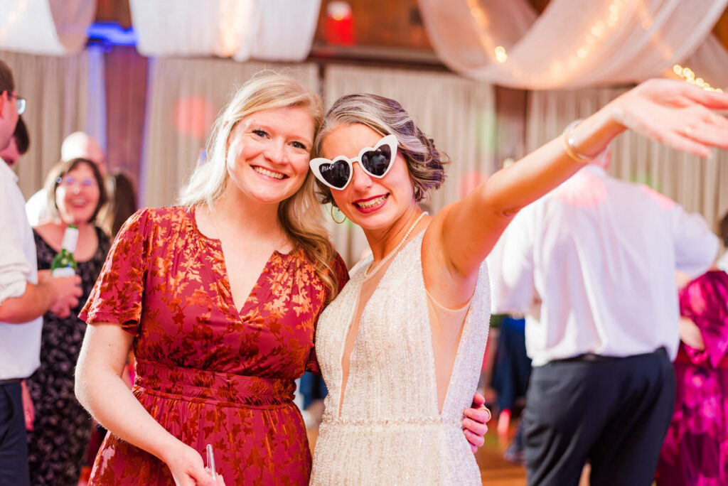 bride and wedding guest smiling