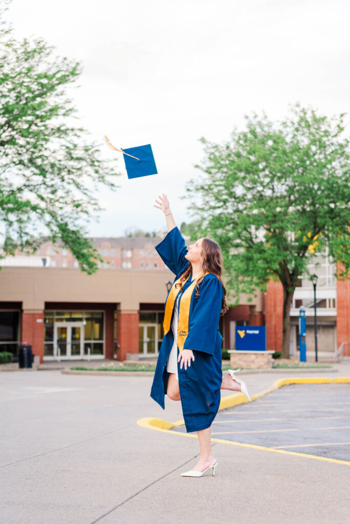 graduationcaptoss3 carrie white photography wvu grad tossing cap in the air
